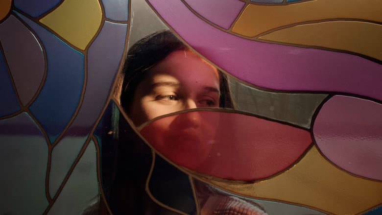 Backdrop from Cracks run through this multicolored glass